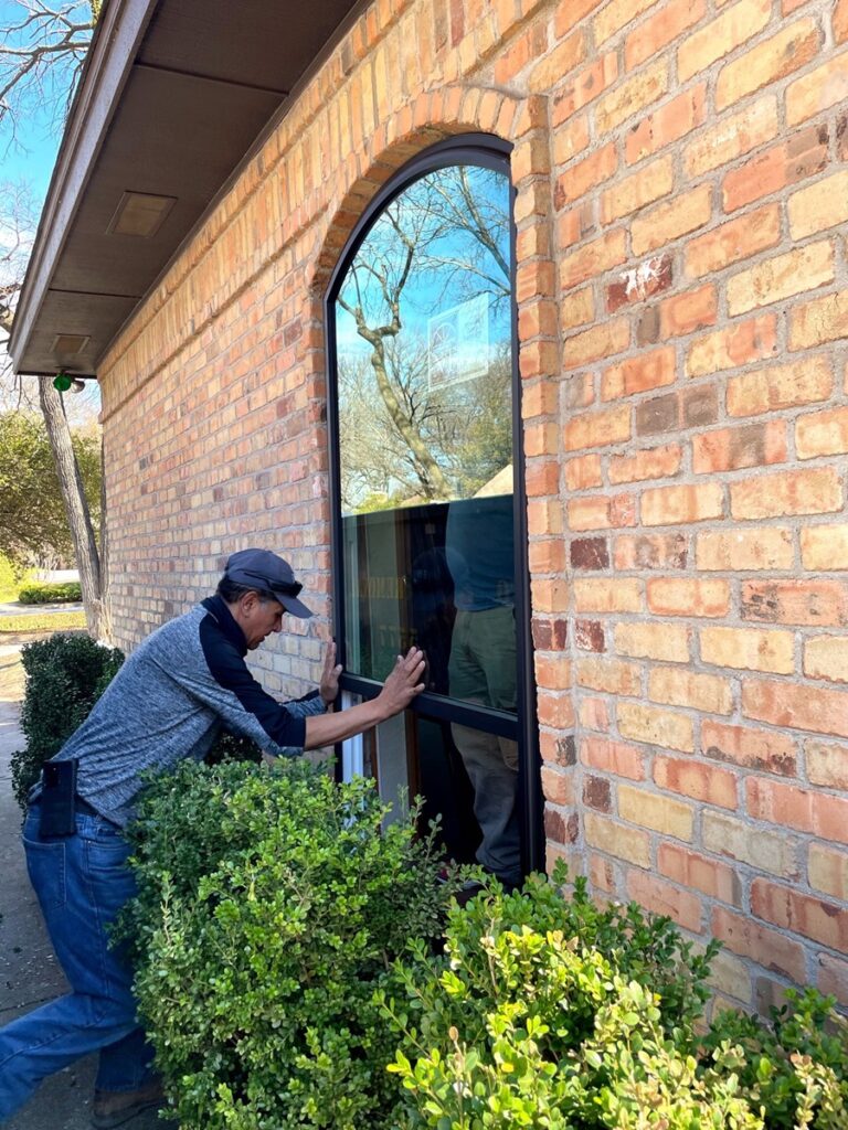 A-man-installing-energy-efficient-replacement-windows-in-conway-ar